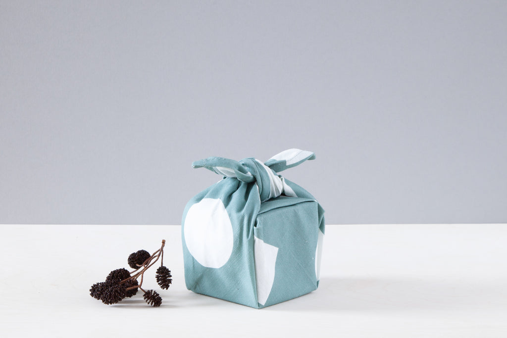 Ola Organic Cotton Wrap with Shapes Print in Turquoise and White. Made in Japanese Furoshiki style, washable and reusable.